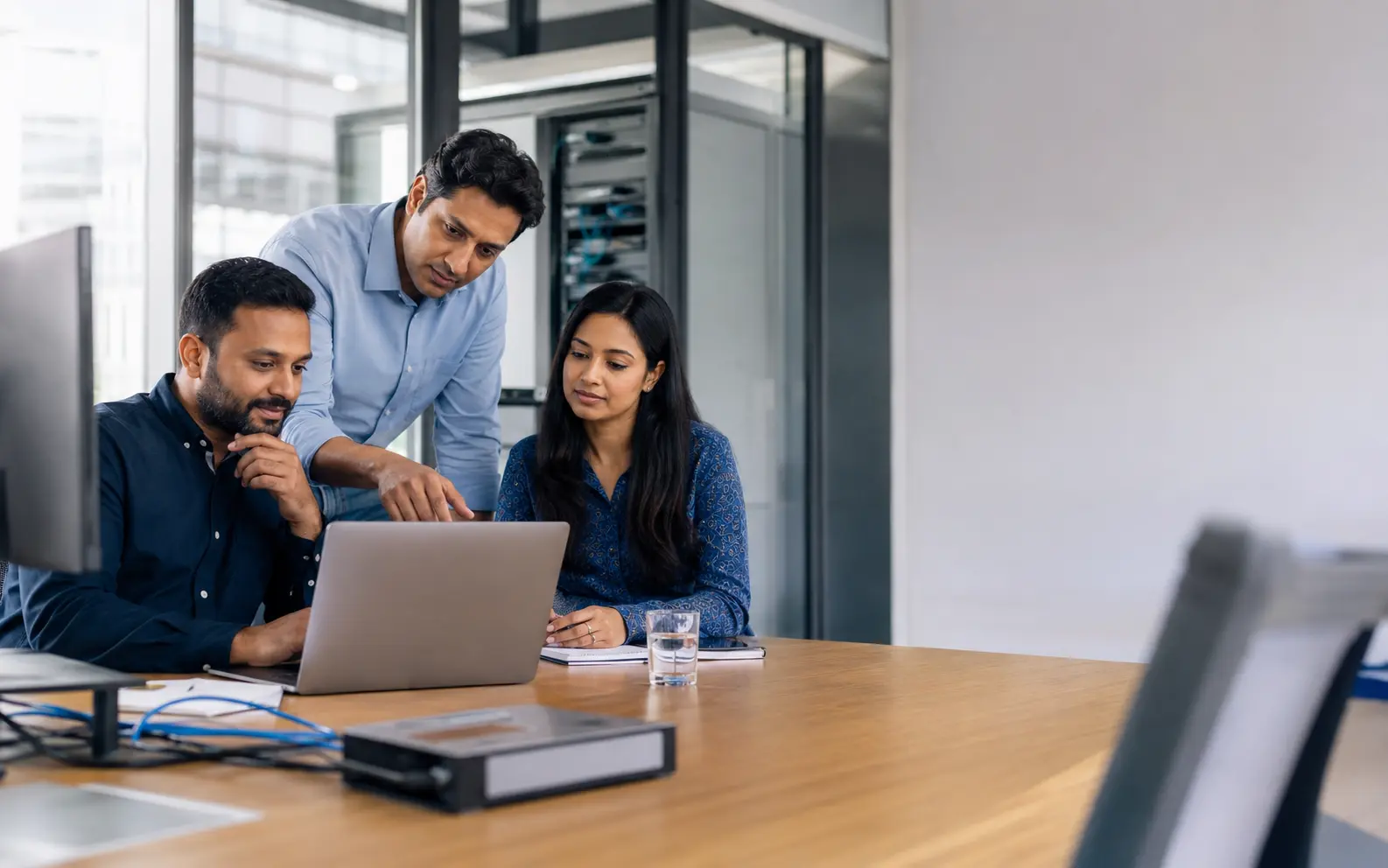 A business team planning a workplace technology deployment